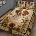 Close view of a Brittany Spaniel quilt blanket with a large dog portrait and sunflower border