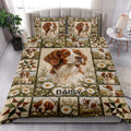 Brittany Spaniel quilt bedding styled in a bright bedroom with floral dog artwork