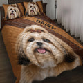 Lhasa Apso quilt blanket displayed on a bed with matching dog portrait pillow designs in warm brown tones