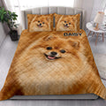 Pomeranian quilt blanket styled in a bright bedroom with matching dog portrait pillows