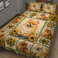 Close bedroom view of a Pomeranian quilt blanket with sunflower bouquets and patchwork panels