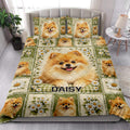Pomeranian quilt blanket styled on a bedroom bed with floral borders and repeated dog portraits