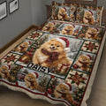 Close view of Pomeranian Christmas quilt blanket with festive scenes, gifts, trees, and patchwork stars