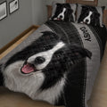 Close view of a black and white Border Collie quilt blanket with matching pillows