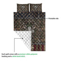 Hunting quilt showing the printed camouflage antler design and white quilted backing