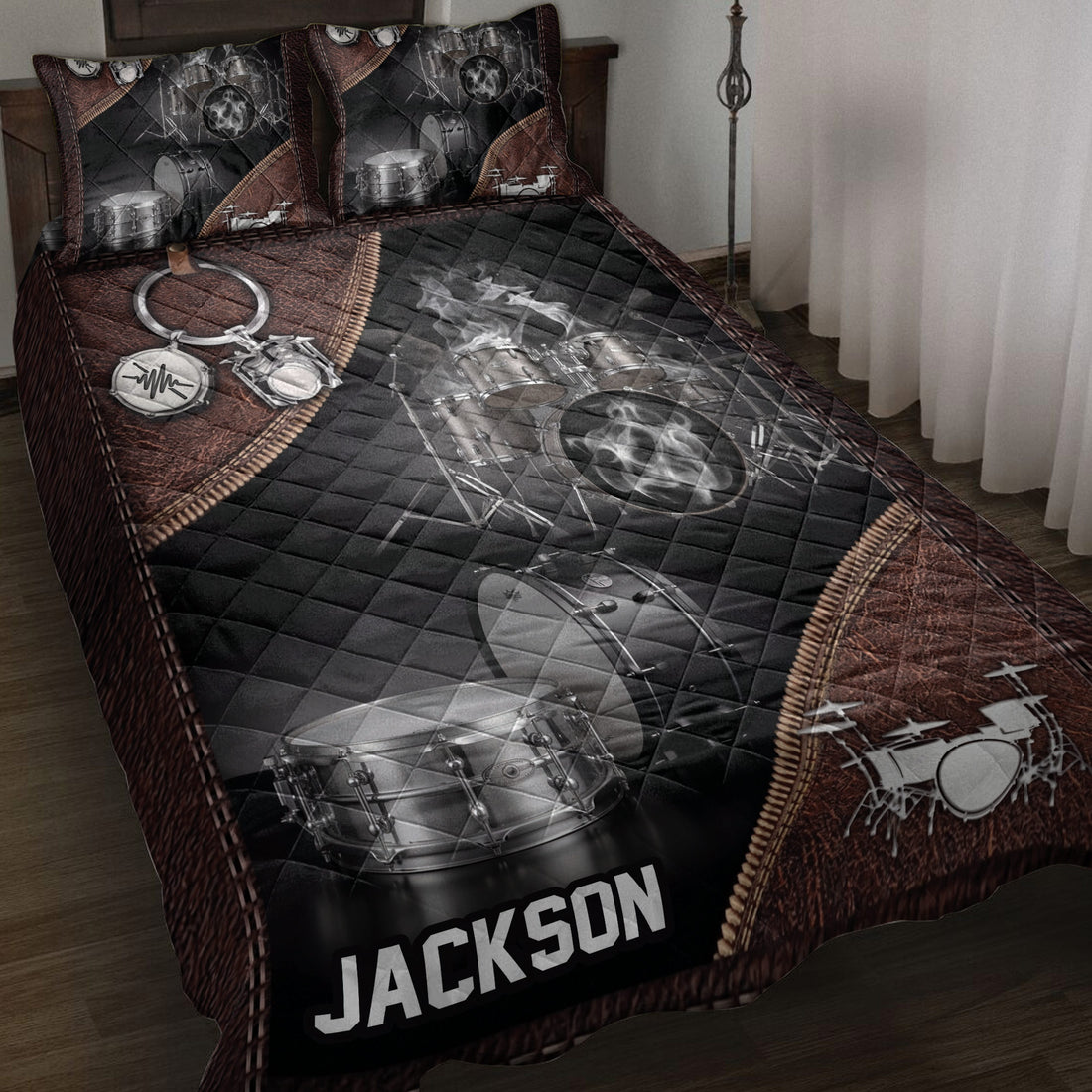 Drum quilt bedding set displayed on a bed with black and brown percussion artwork