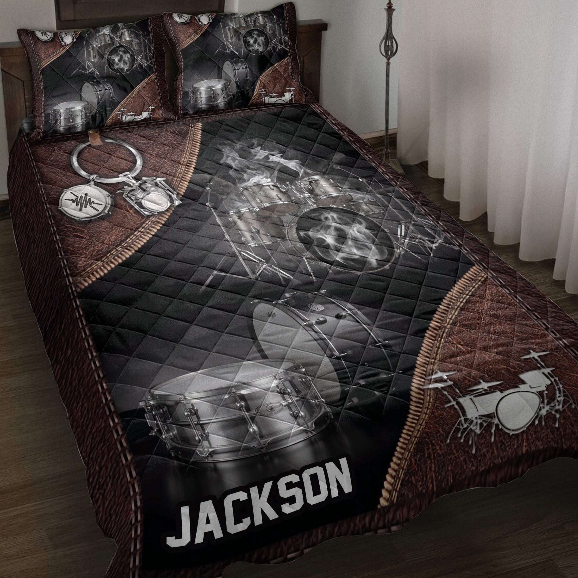 Drum quilt bedding set displayed on a bed with black and brown percussion artwork