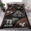 Drum quilt bedding set styled in a bedroom with black, silver, and brown drum artwork