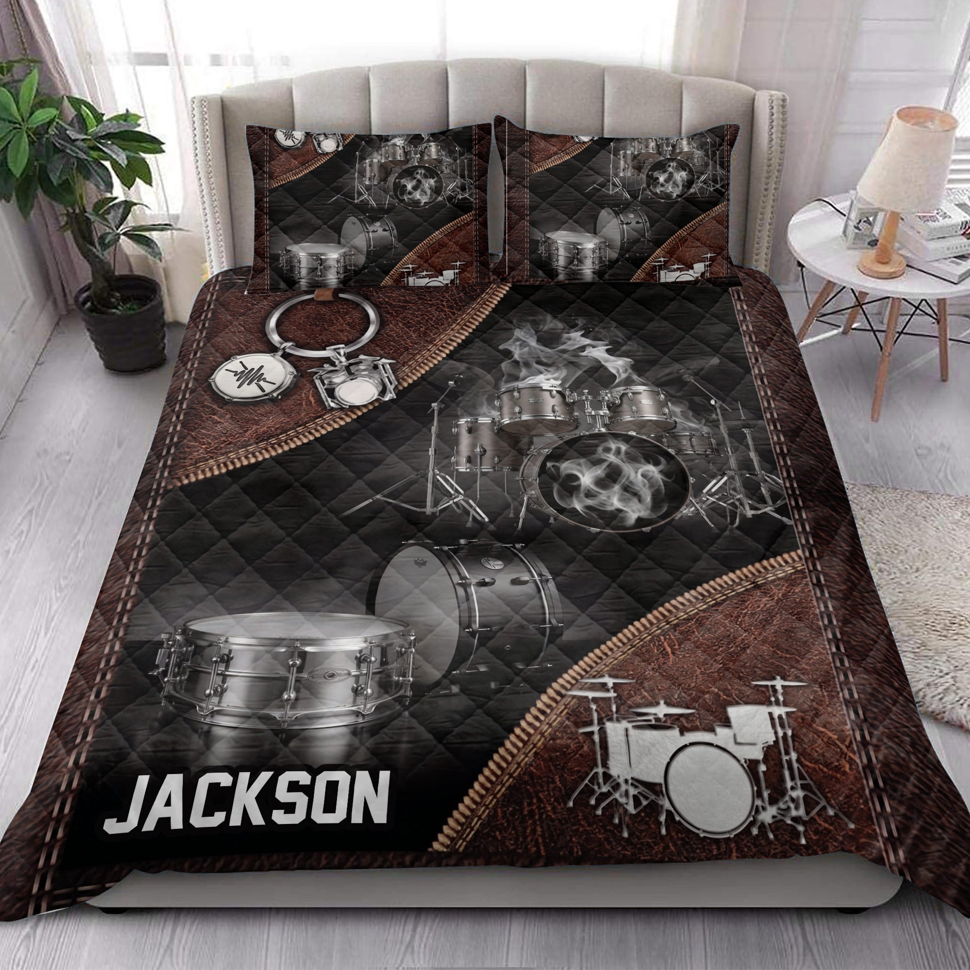 Drum quilt bedding set styled in a bedroom with black, silver, and brown drum artwork
