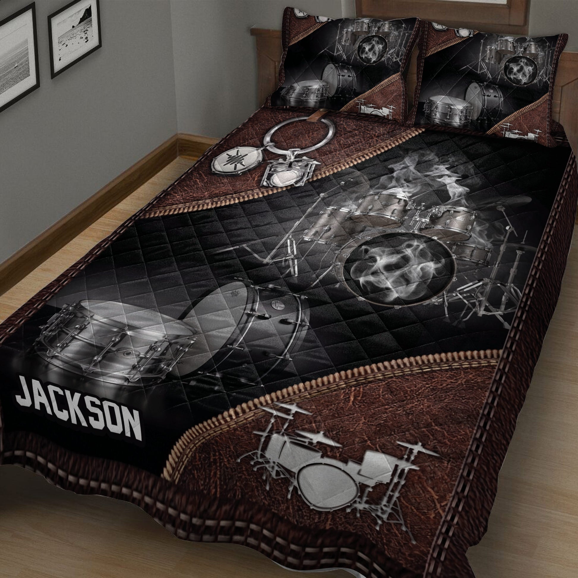 Close bedroom view of a drum quilt featuring a detailed silver drum kit and dark quilted background