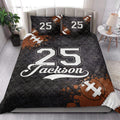 Football-themed quilt blanket styled in a bright bedroom with bold sports graphics