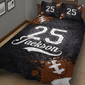 Close view of black football quilt bedding with football artwork and large jersey-style graphics