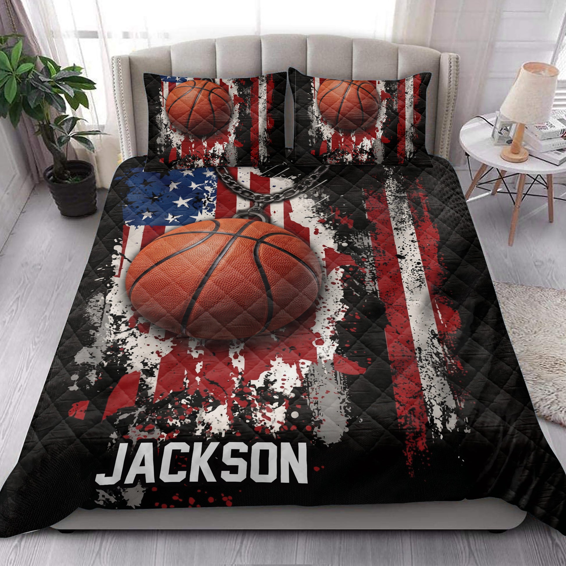 Basketball quilt bedding styled in a bright bedroom with bold sports artwork and matching pillows