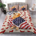 Patriotic Golden Retriever quilt blanket displayed on a bed with paw prints and red dog silhouettes