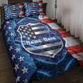 Police quilt blanket displayed on a bed with a patriotic shield design, stars, blue lightning, and red accents