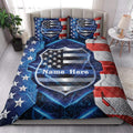 Police quilt blanket styled on a bed with matching shield artwork, stars, lightning, and patriotic red and blue colors