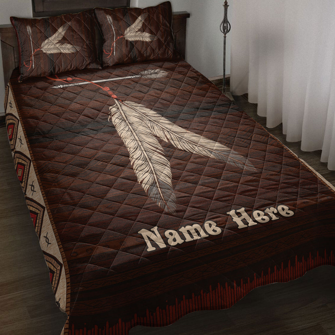 American Native feather quilt blanket styled on a bedroom bed with earthy brown geometric artwork