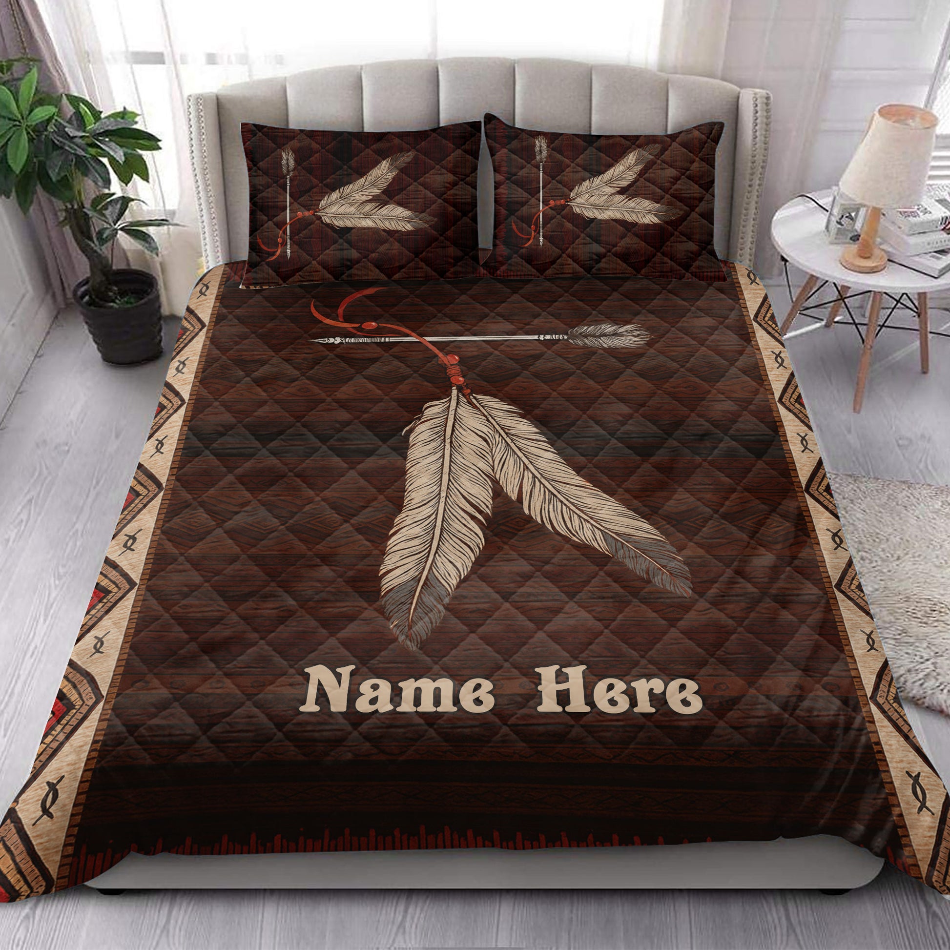 American Native feather quilt blanket displayed in a bright bedroom with coordinated earthy decor