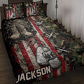 Veteran quilt blanket displayed on a bed with military boots, dog tags, camouflage and patriotic flag artwork