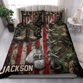Veteran quilt blanket styled in a bedroom with military boots, dog tags, camouflage and red, white and blue artwork