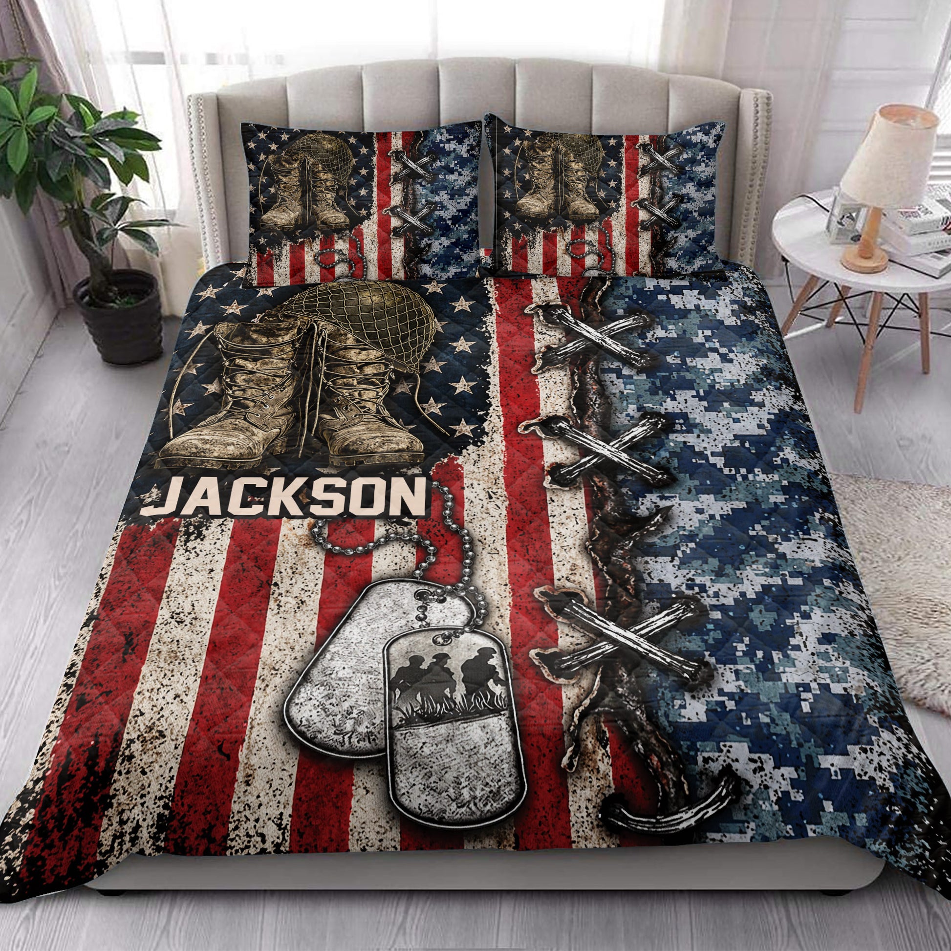 Veteran quilt blanket styled in a bedroom with combat boots, dog tags and patriotic military artwork