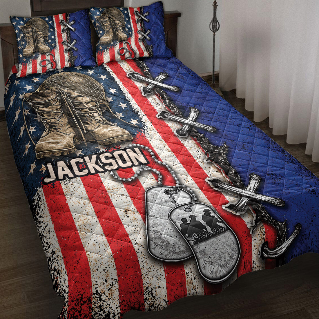 Veteran quilt blanket displayed on a bed with combat boots, dog tags, crossed rifles, and patriotic red, white, and blue artwork