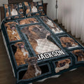 Boxer dog quilt blanket spread across a bed with framed Boxer portraits and dark teal borders