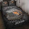 Trucker quilt blanket displayed on a bed with bold orange semi-truck artwork and rugged black design
