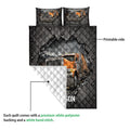 Trucker quilt blanket detail showing printed front, white quilted backing, and semi-truck artwork
