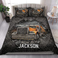 Trucker quilt blanket styled on a bed with dramatic orange semi-truck artwork and dark industrial decor