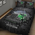 Close view of a green semi-truck quilt blanket featuring detailed cab artwork and rugged black road textures