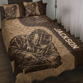 Brown welder quilt blanket displayed on a bed with protective helmet artwork and industrial welding details