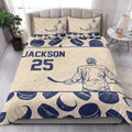 Hockey quilt blanket styled in a bright bedroom with navy player and puck artwork