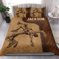 Wrestling quilt blanket styled on a bedroom bed with bold grappling artwork in warm brown tones
