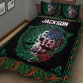 Close view of Irish Celtic quilt bedding with shamrocks, harp motifs, Celtic knots, and a multicolor tree emblem