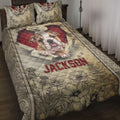 English Bulldog quilt blanket displayed on a bed with floral artwork and warm red and beige tones