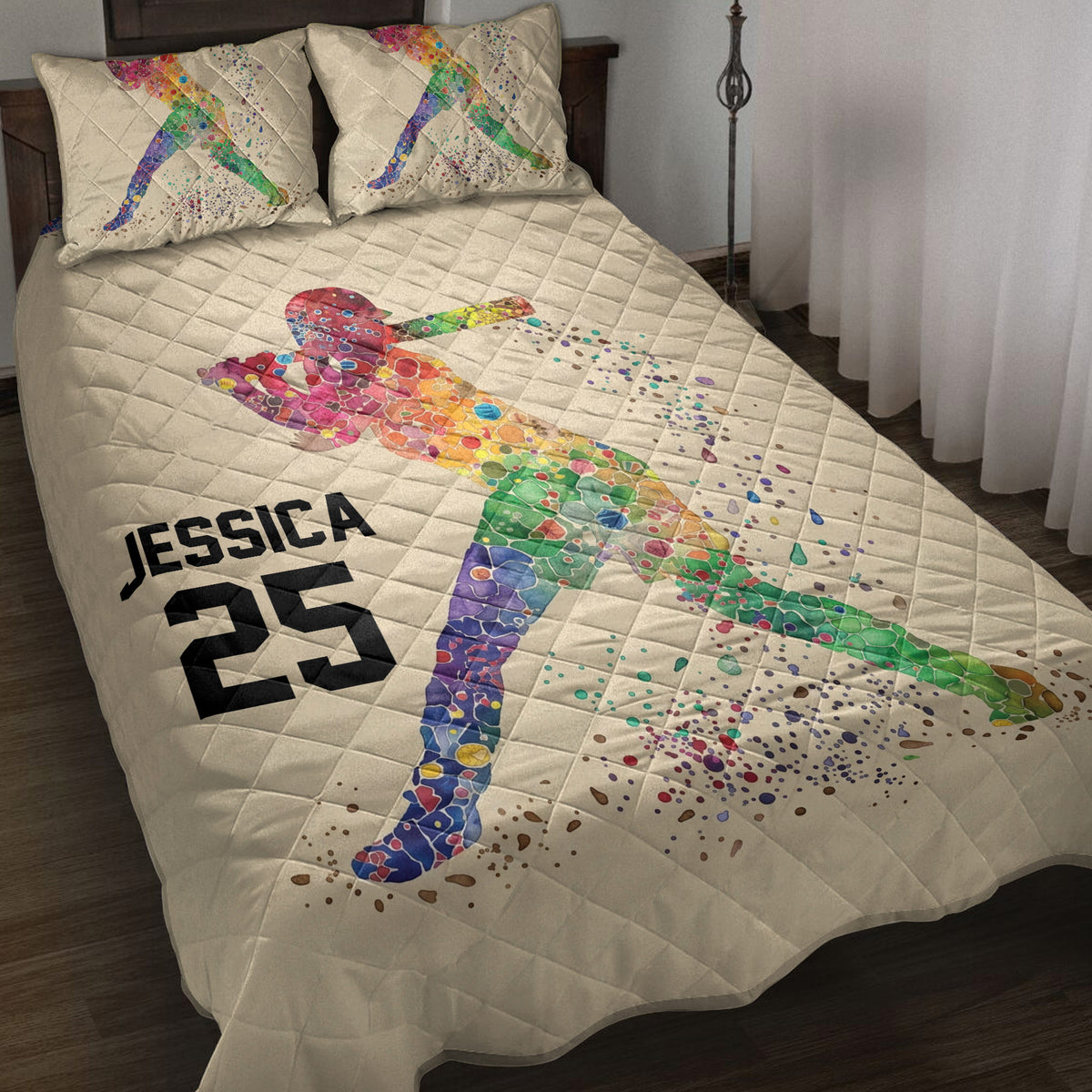 Colorful softball batter artwork on a quilt blanket styled across a bedroom bed