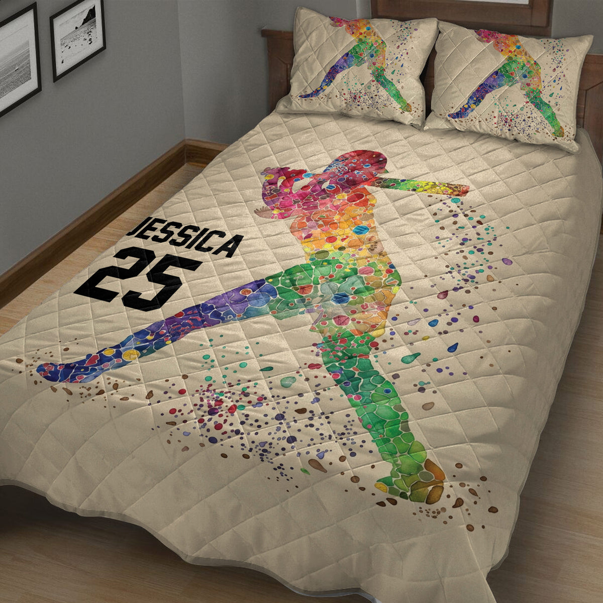 Angled bedroom view of a colorful softball quilt blanket with batter artwork