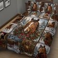 Close view of a horse quilt blanket featuring a central horse portrait, snowy cabin scenes, and holiday greenery