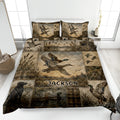 Duck hunting quilt blanket displayed on a bed with mallard ducks, wetlands, cattails, and rustic outdoor artwork