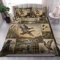 Duck hunting quilt blanket styled in a bright bedroom with mallard ducks, marsh scenery, and rustic bedding artwork