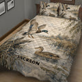 Duck hunting bedding set shown on a bed with detailed mallards, cattails, pond water, and marsh artwork