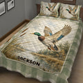 Duck hunting quilt blanket shown in a rustic bedroom with mallard, cattail, woodland, and wetland scenery