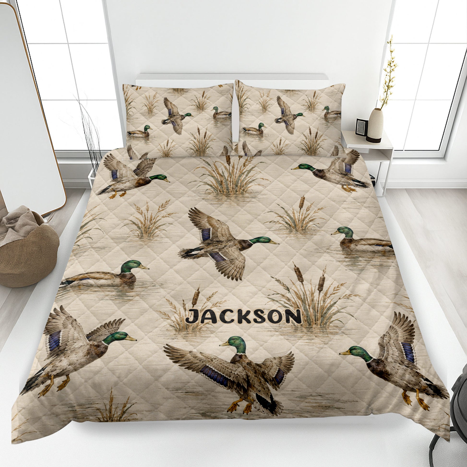 Duck hunting quilt blanket displayed on a bed with mallards, cattails, marsh scenery, and a custom design