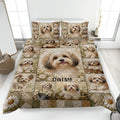 Havanese quilt blanket displayed on a bed with floral panels and multiple cheerful dog portraits