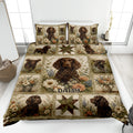 Boykin Spaniel quilt blanket displayed on a bed with floral panels, patchwork stars, and earthy botanical colors
