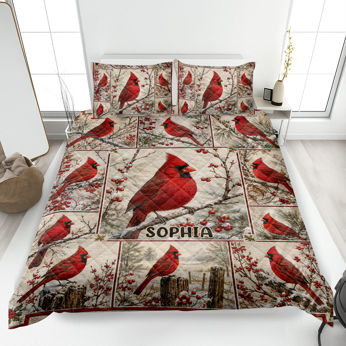 Cardinal quilt blanket displayed on a bed with red birds, winter branches, berries, and a custom central panel