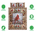 Cardinal quilt bedding set shown with red bird artwork and soft, breathable, machine washable feature icons
