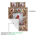 Cardinal quilt blanket detail showing the printed bird design and white quilted backing