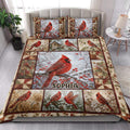 Cardinal quilt bedding set styled in a bright bedroom with red birds, berries, branches, and floral panels